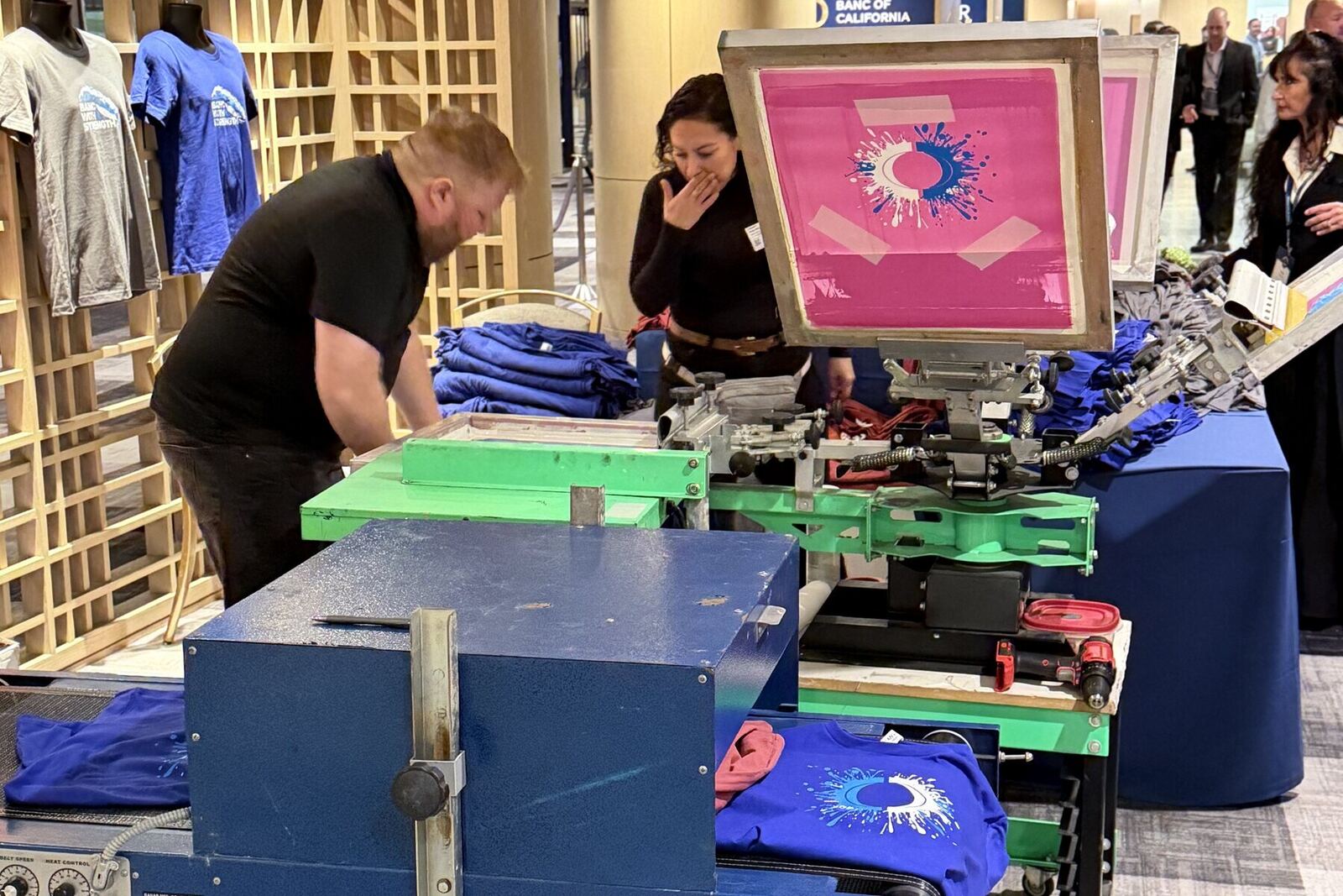 DTF transfer sheets staged in production before an event line opens