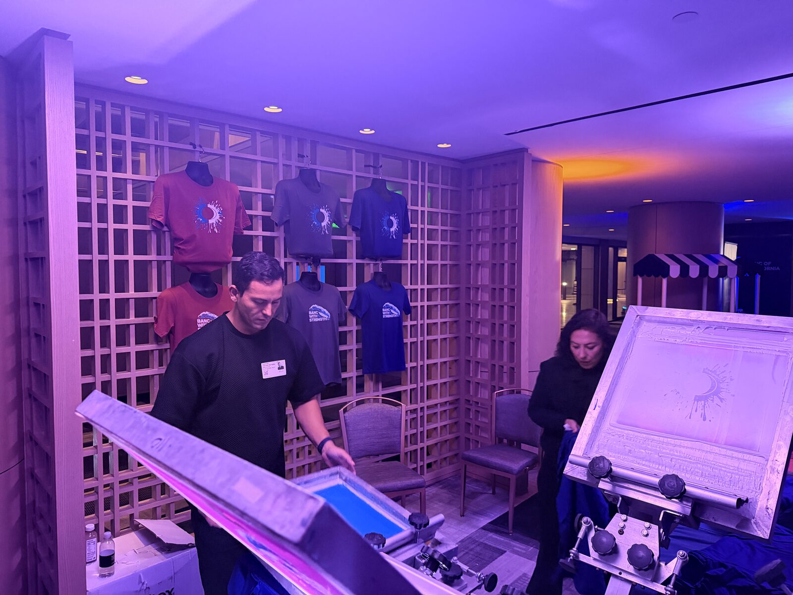 Wall of finished event shirts produced on site